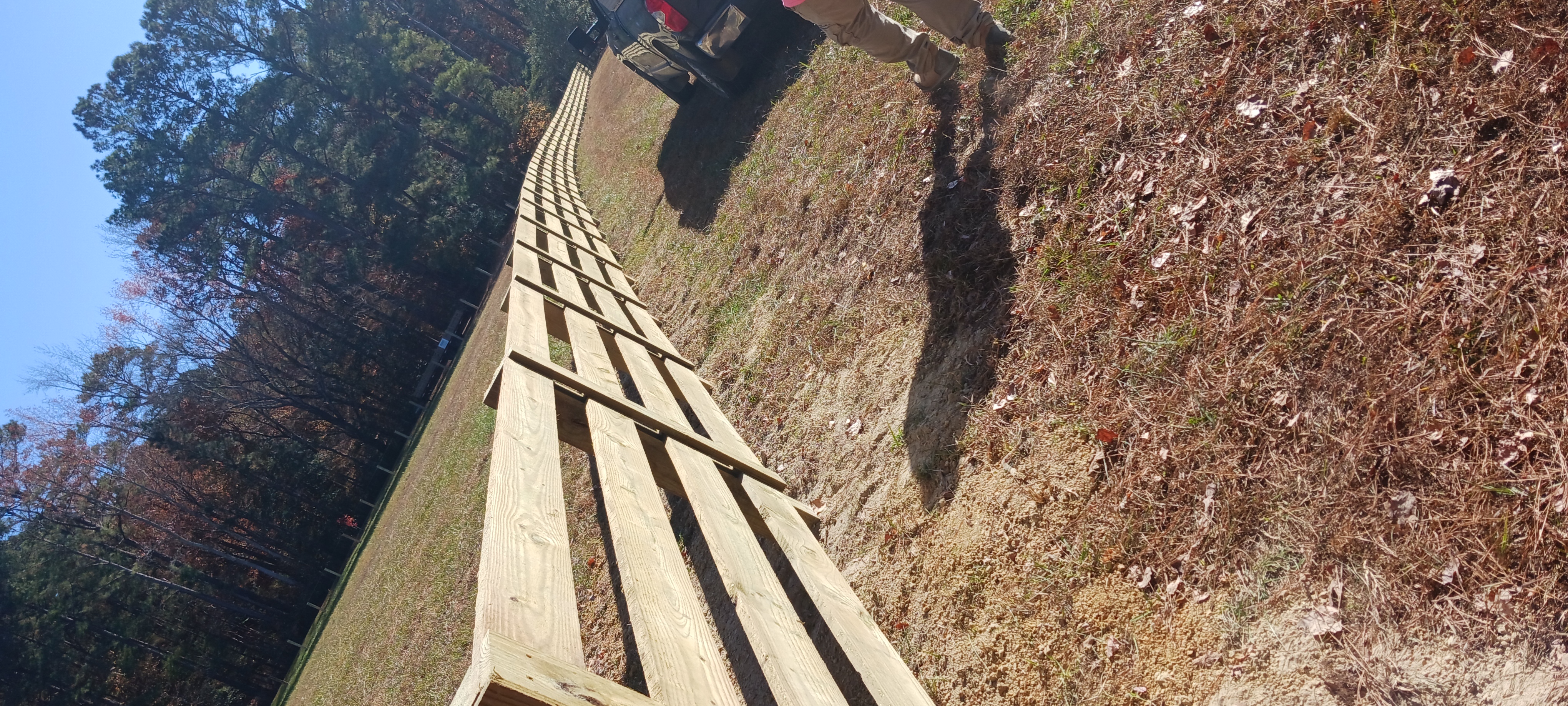 Wood privacy fence with matching gate installed by A and D Fencing.
